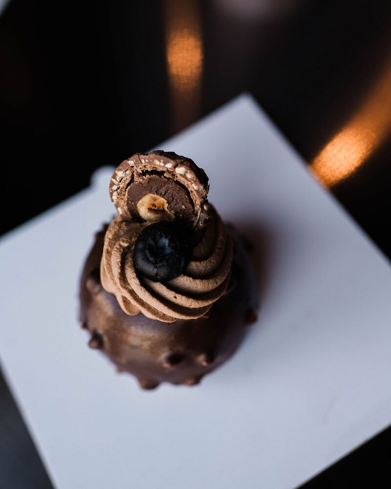 Chocolate mousse cake with a piped chocolate swirl