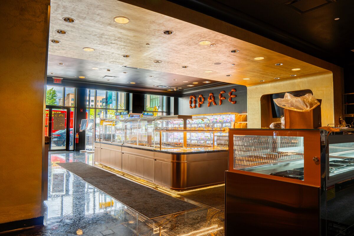 Pastry display counter under a gold ceiling
