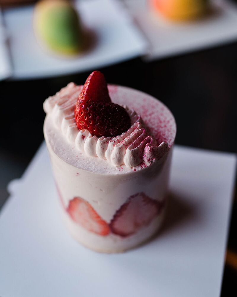 Strawberry mousse cake topped with a fresh strawberry