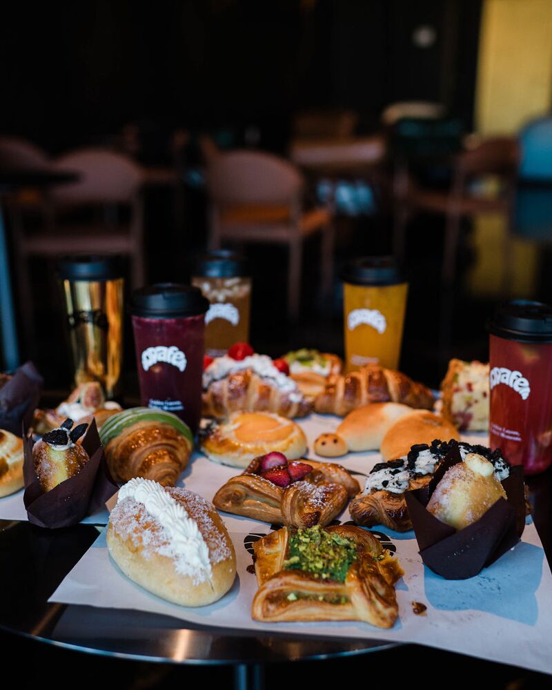 A table of Opafe pastries and drinks