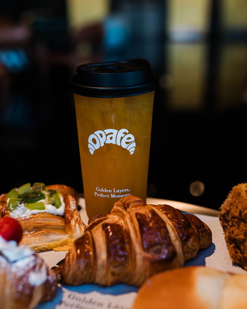 Fruit tea with a croissant and danishes