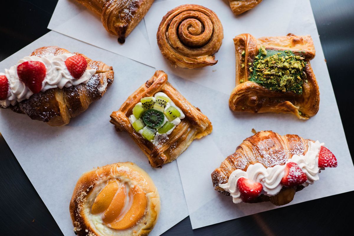 Strawberry croissants, kiwi and pistachio danishes, an apricot danish and a cinnamon swirl